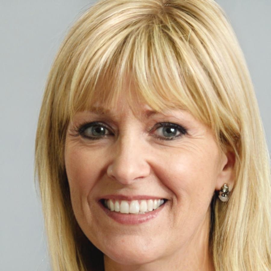 Instructor Sienna Blackwell reviewing financial documents